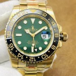 Rolex GMT-Master series, green dial, black bezel, 40mm, gold Oyster bracelet.